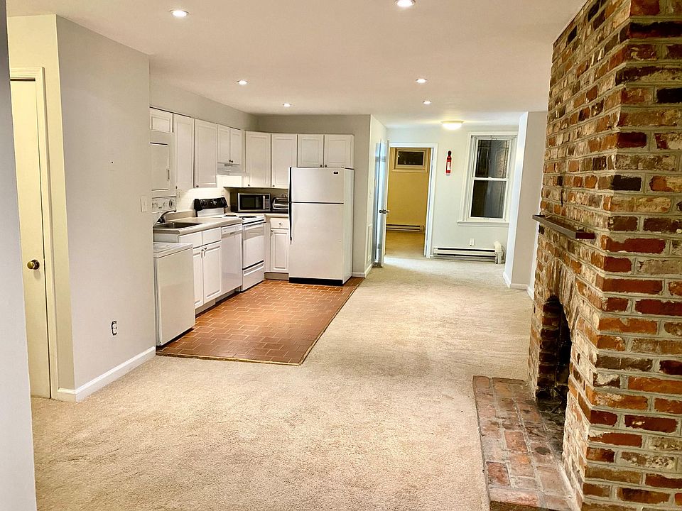 Living and kitchen area with working fireplace