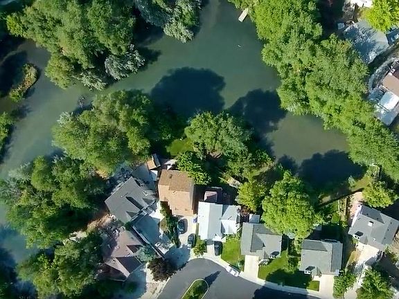 Ariel View of our home. Next to light brown roof to the right. Fenced in back yard with a gate access to Wild life sanctuary!