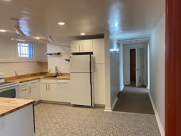 Looking into the kitchen and down the hall from the living room.