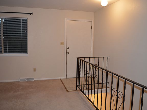 front entry and living room, stairs to lower level