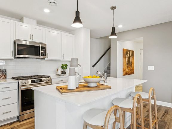 The center island at the heart of the kitchen is perfect for casual meals