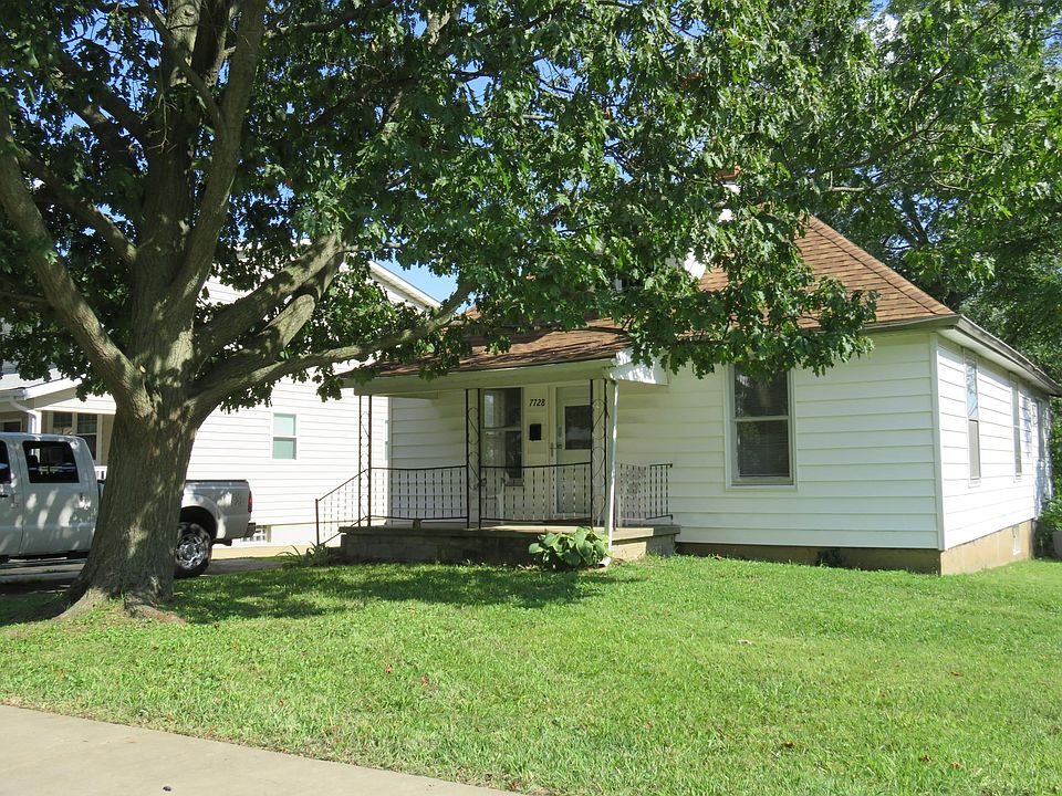Front of house. Off-street parking on left/east side of home.