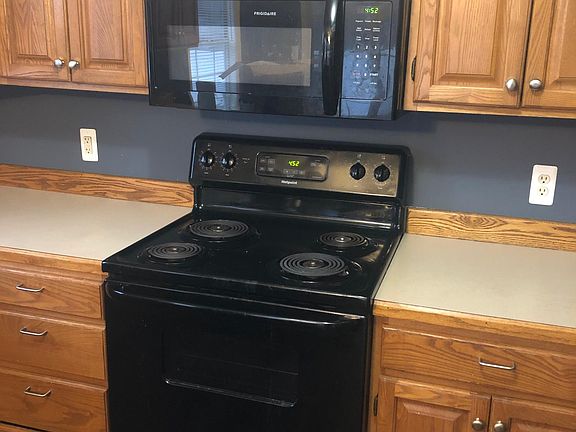 New microwave above stove (2020) and range (2020). The kitchen also features a new dishwasher (2020) and a new refrigerator (2020).
