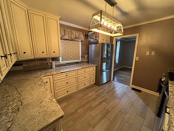 Beautiful remodeled kitchen with granite counters, new cabinets and stainless steel appliances.
