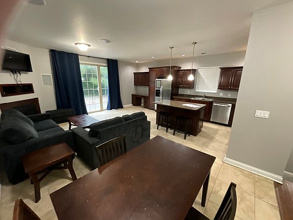 Backing living area with walk-out deck