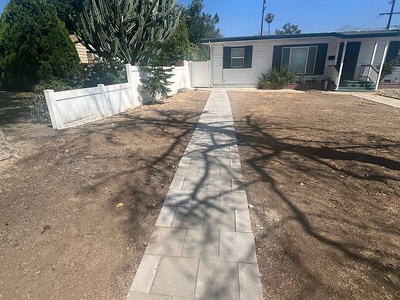 private walkway to unit with side gate