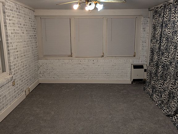 Family room/3 seasons room with new carpet.