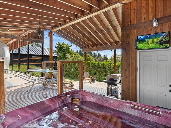 The covered back deck offers private outdoor living space.