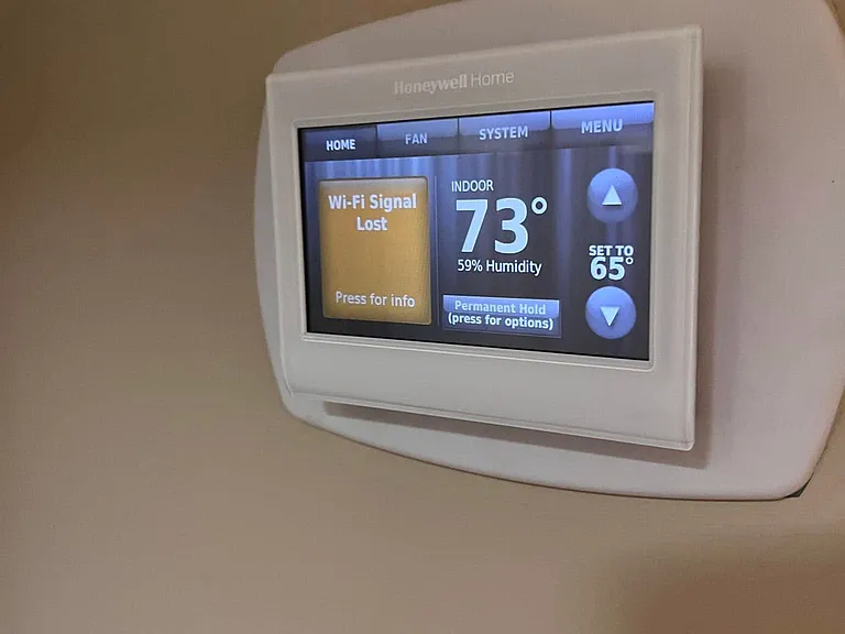 Honeywell Wifi capable thermostat. Control the temperature of the home remotely with your cell phone.