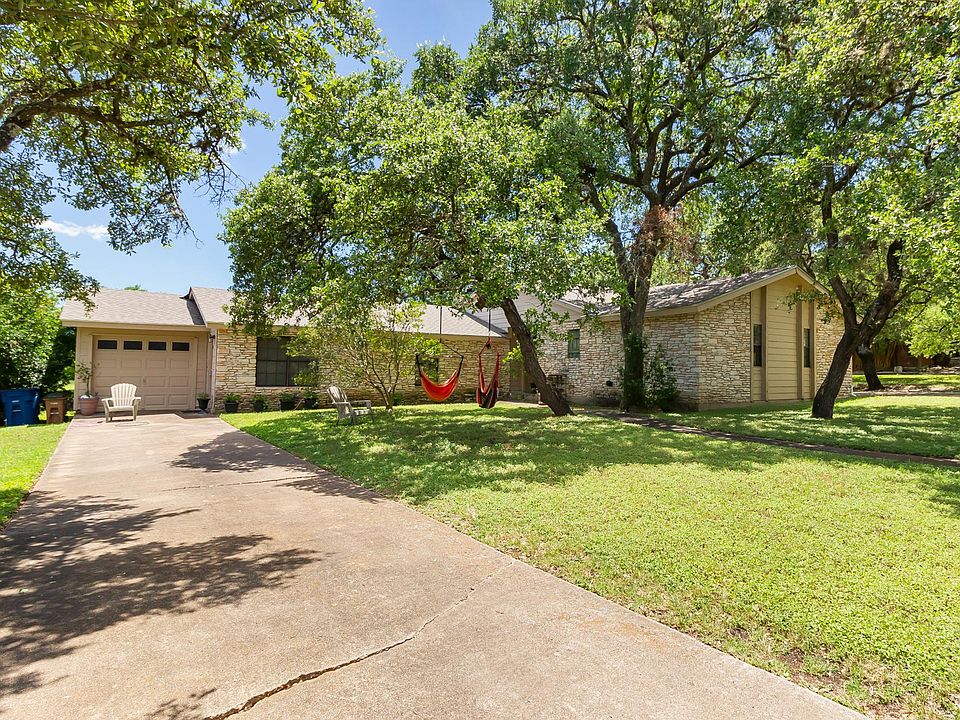 6301 Latigo Pass A. Front entry next to garage. Entry for B in corner behind hammock in tree.