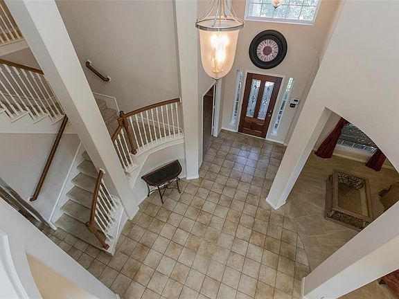 Enter the home into the large inviting two-story foyer