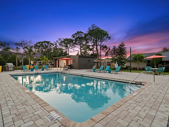 Sparkling Swimming Pool with Chaise Lounges