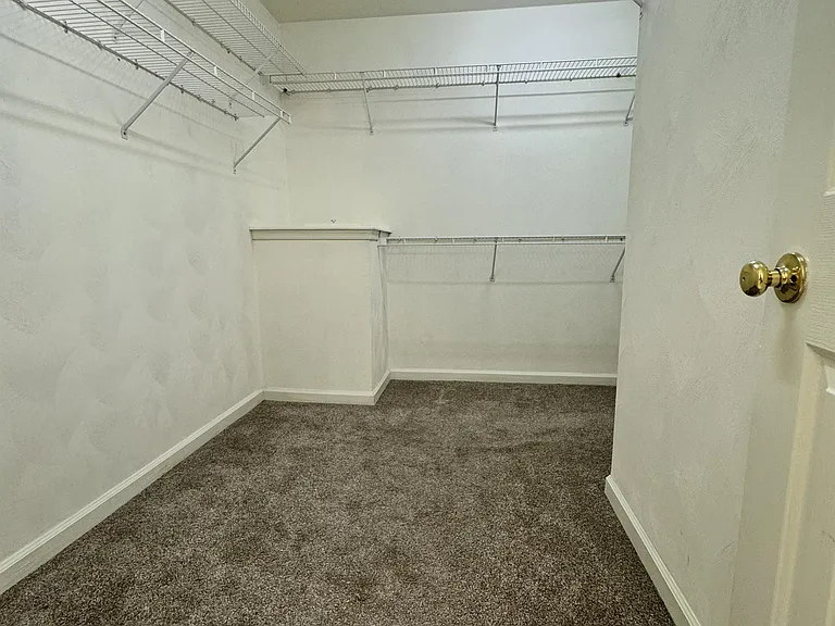 Primary walk in closet... HUGE
