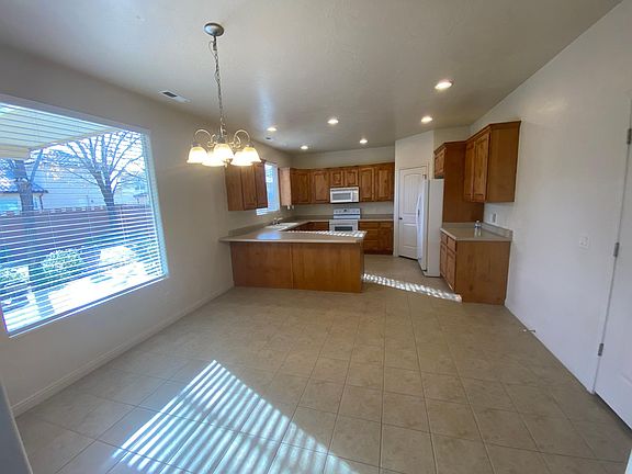 Large kitchen with ample cabinet space. Laundry room off the kitchen.
