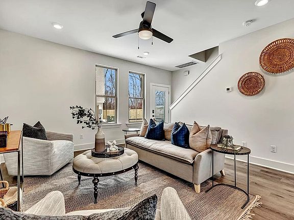 First Floor: living area; front door pictured