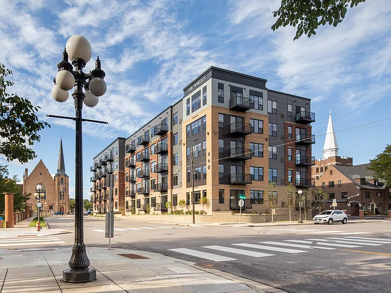 Full exterior street view of The Whitley apartment building.