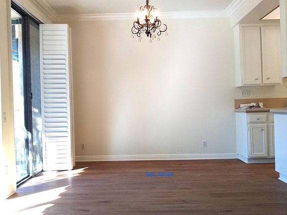 Dining area off kitchen with balcony and great light