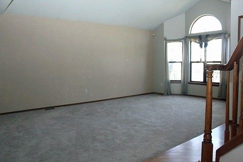 Living Room has Beautiful Tall Windows with Lots of Light!