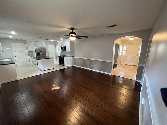 Den looking to Foyer, Kitchen, and Dining Room - southeast to northwest