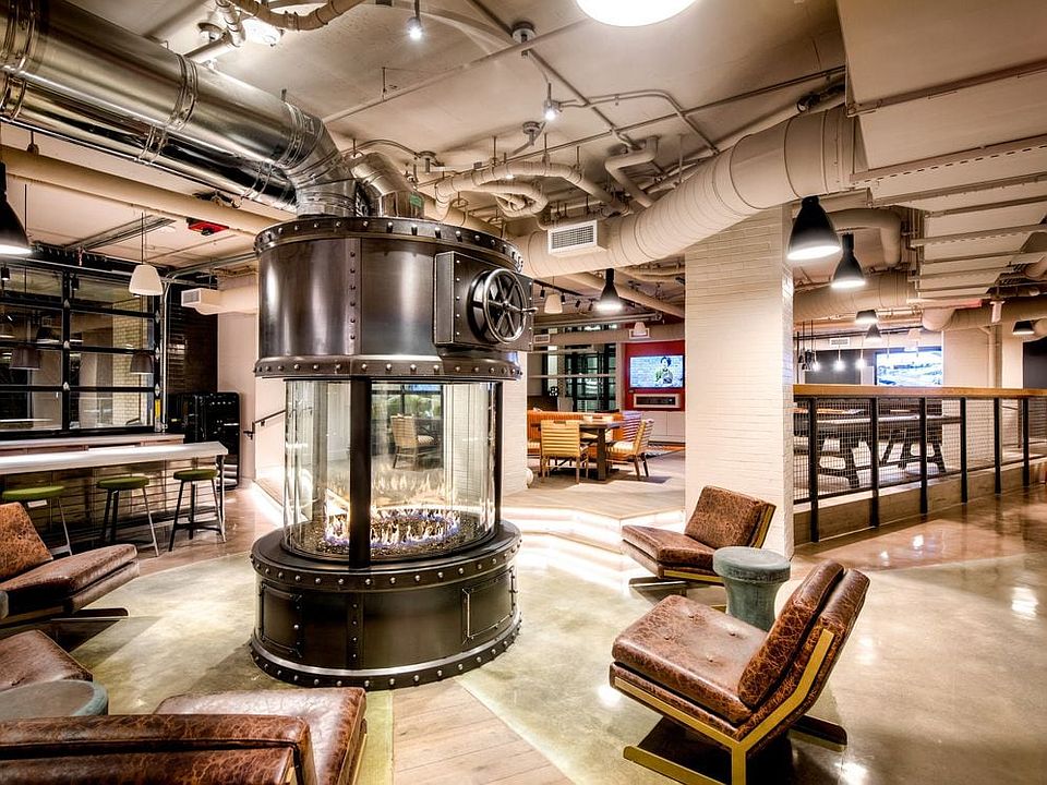 Lobby loft with fireplace feature and common area seating