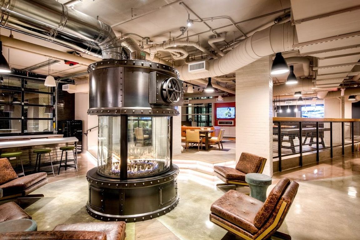 Lobby loft with fireplace feature and common area seating