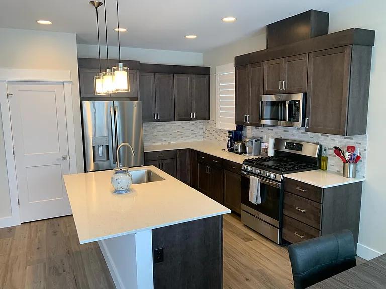 Kitchen with stainless steel appliances with pantry