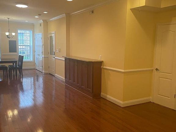Sitting room to front door and laundry closet