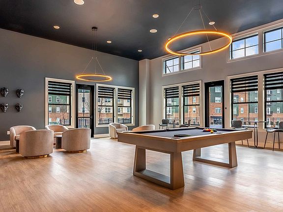 Experience modern elegance in this bright and inviting lounge space, perfect for relaxation and entertainment.