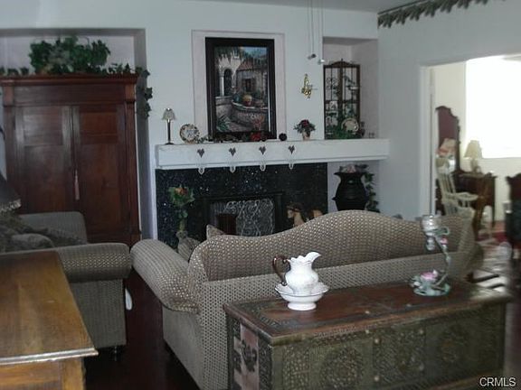 fAMILY ROOM WITH FIREPLACE AND ENTERTAINMENT SET IN
