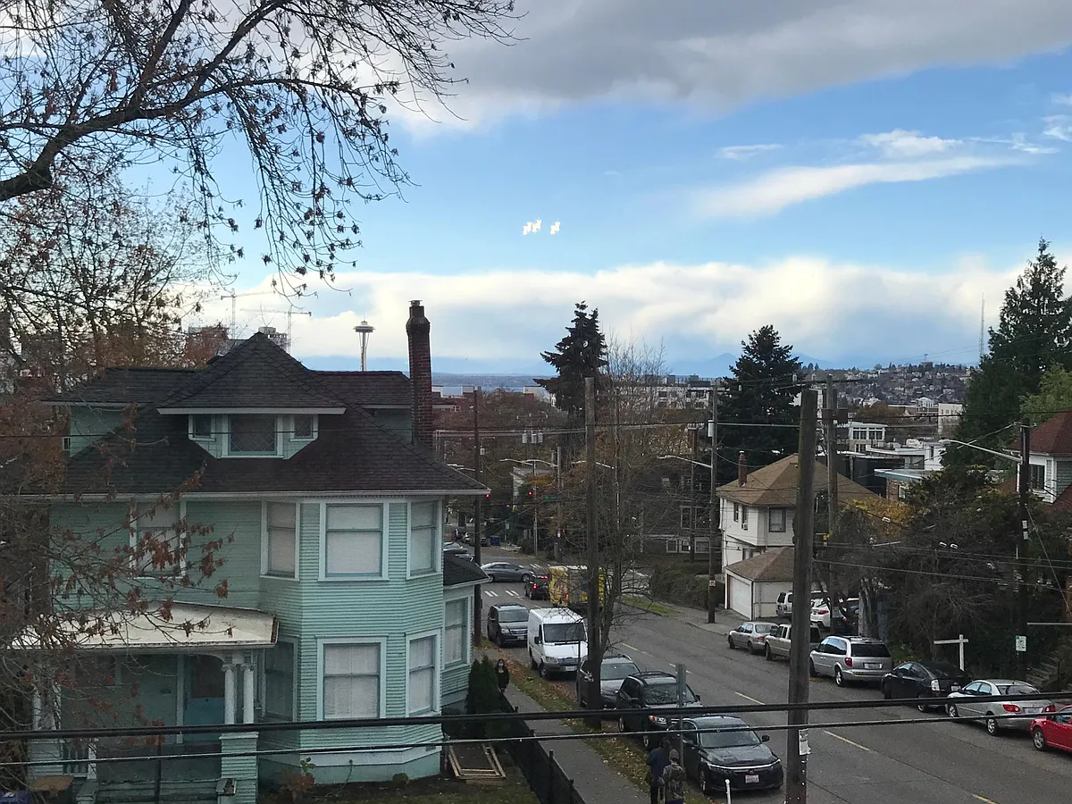 West facing living room window with view of Downtown, Space Needle, Puget Sound, and Olympic mountains - 1307 E John St #302