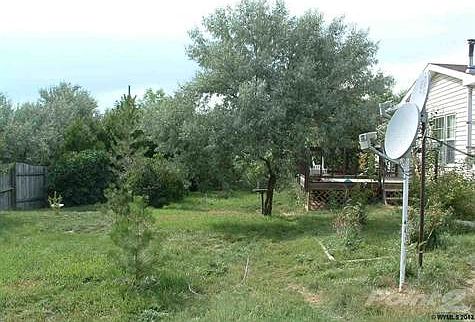 Out the family room door to the deck with fenced yard.