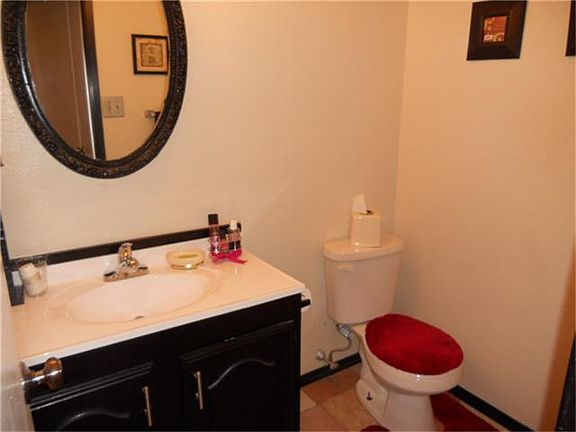 1/2 bath by the front door and garage area.