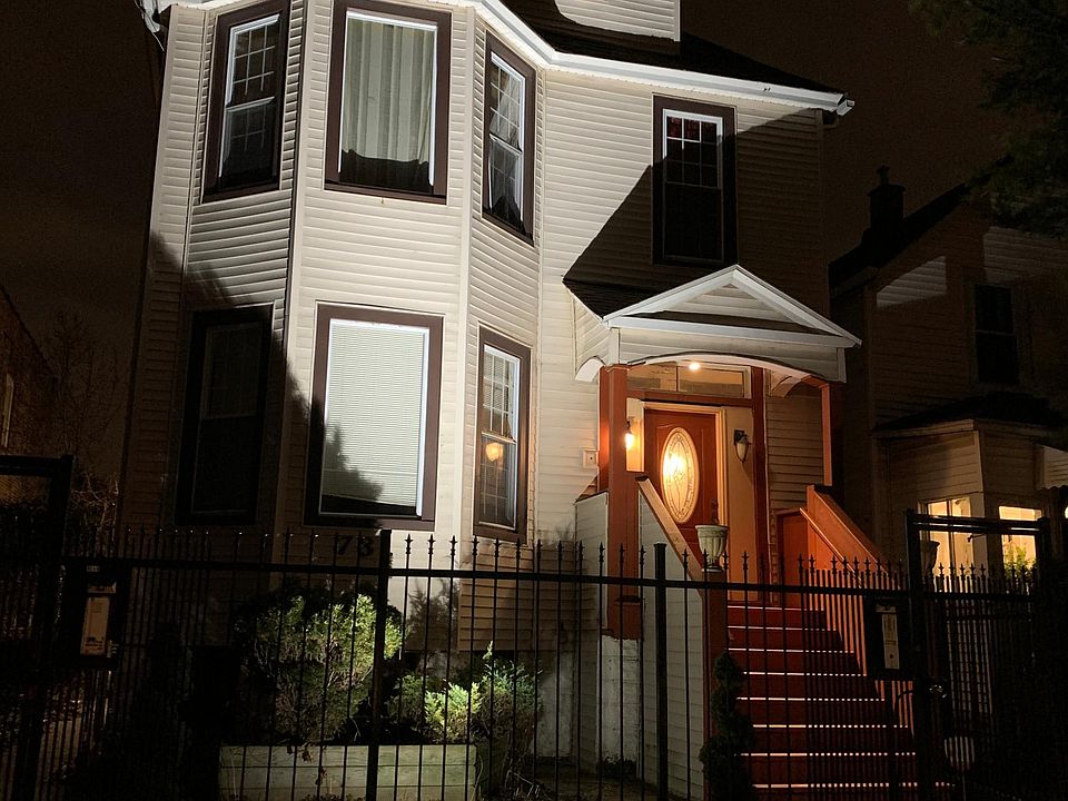 Front of building at night . Same amount of light on all entrances