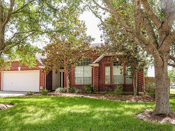 Tree lined corner lot and brick on all 4 sides!