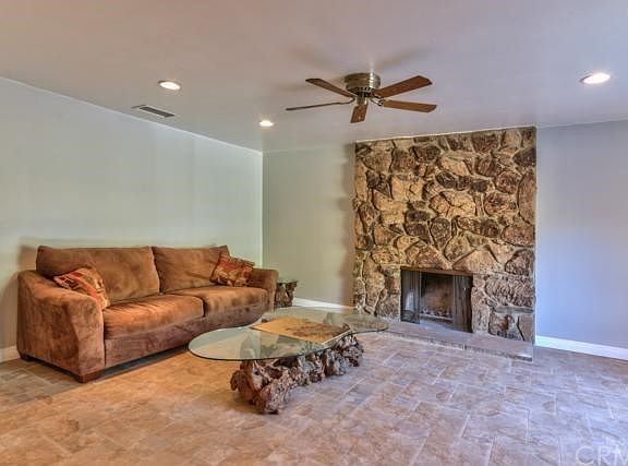 LIVING ROOM LEFT SIDE, NEW PAINT, TILE FLOORING, RECESSED LIGHTING, GAS AND LOG FIREPLACE