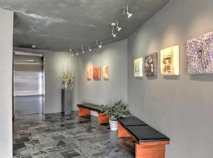 Building Entry Foyer With Local Art and coded Elavtor