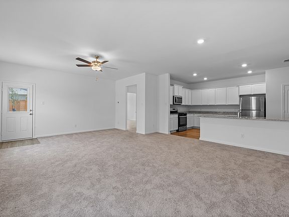 The spacious family room that leads into the kitchen