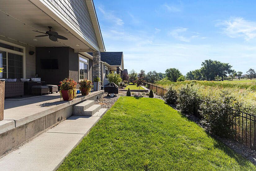 Private patio with yard