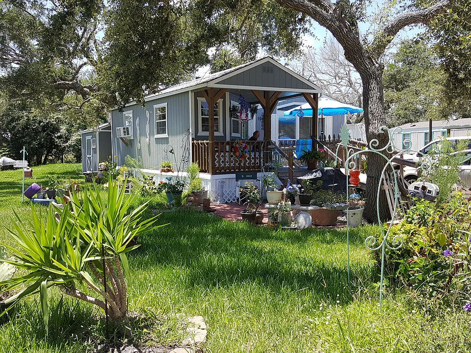 Shows 8 by 12 Shed behind Cabin