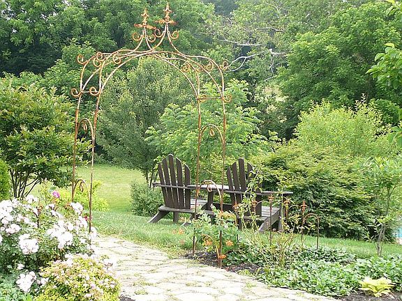 Back stone walk from driveway to back deck and pool steps