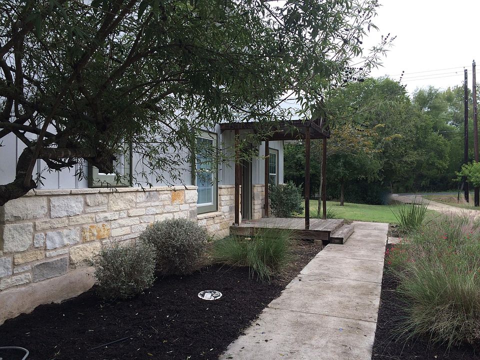 view from driveway toward the front entry and the driveway