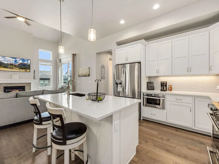 Fully equipped kitchen with gas stove, dishwasher, large refrigerator and big island for preparing meals
