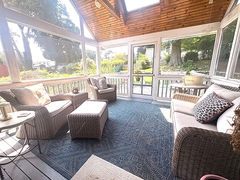 Bright and cozy screened in porch.