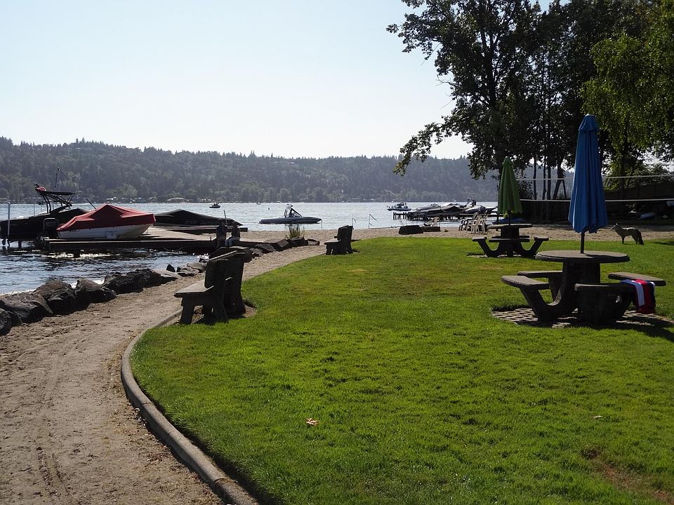Sandy beach and volleyball court with picnic area. 