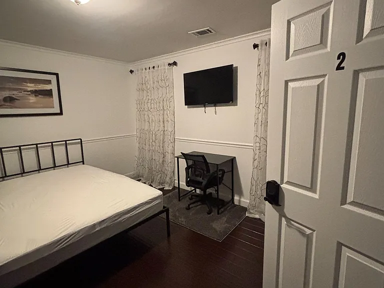 Bedroom 2 with TV and desk