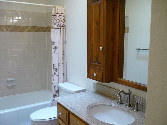 HALL BATH: Tub/Shower Combo/ Tile Floor/ Extra Cabinets