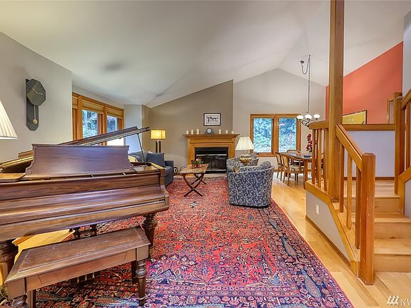 Vaulted ceilings and large windows provide natural light.