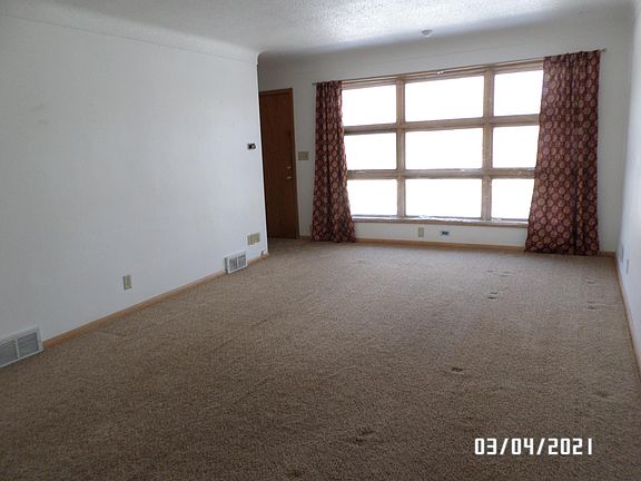 Living room, large window facing east and door to the left opens onto the deck.