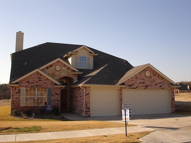 Brick and Stone Elevation with 3 car garage