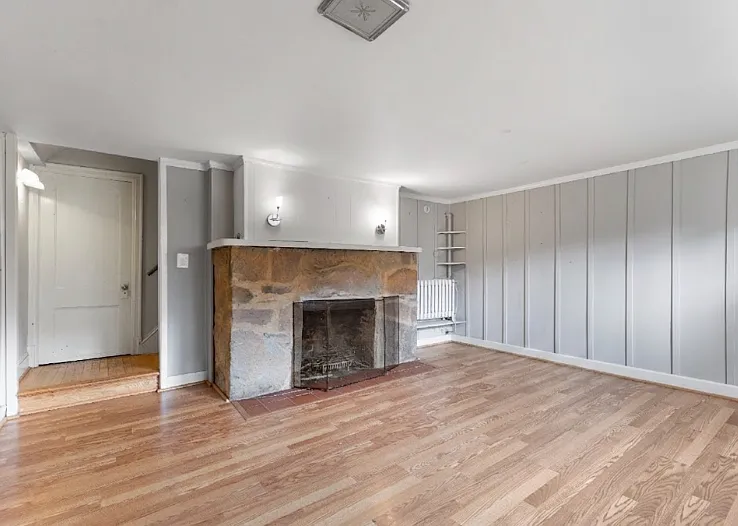 Bonus lower-level living area featuring a second cozy fireplace.